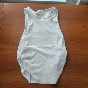 Never worn large tank top . Crop top. Ruched sides .